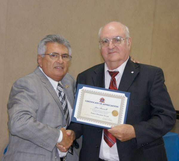Jim Russell receiving an award from Grand Knight Frank Salazar at the Appreciation Dinner 2013