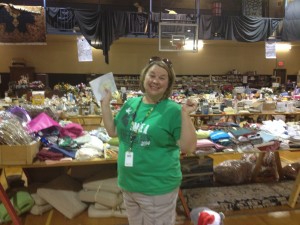 Auction Co-Chair Cindy Meyer seems elated with rummage sales results Saturday afternoon