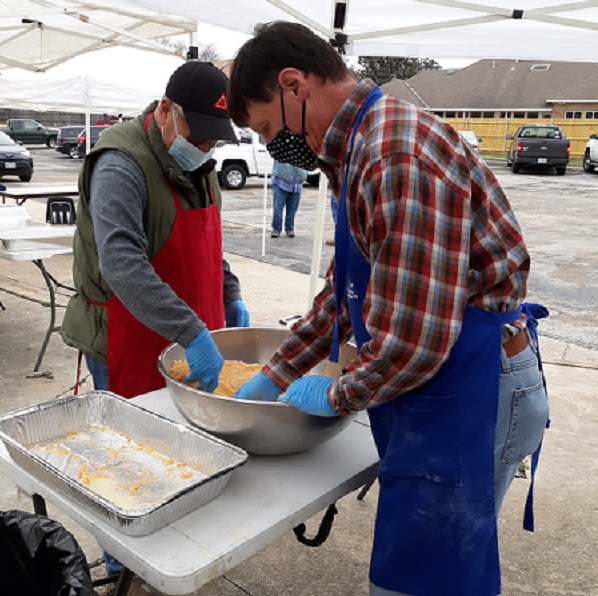 Jeff Miller displays skills at preparing catfish for frying.